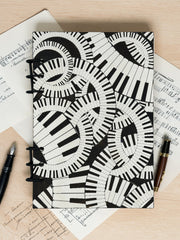 Piano Keyboard Refillable A5 Journal – Music Lover Notebook, Swirling Keys Design