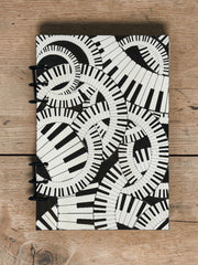 Piano Keyboard Refillable A5 Journal – Music Lover Notebook, Swirling Keys Design