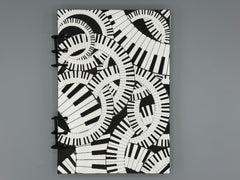 Piano Keyboard Refillable A5 Journal – Music Lover Notebook, Swirling Keys Design