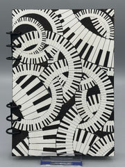 Piano Keyboard Refillable A5 Journal – Music Lover Notebook, Swirling Keys Design